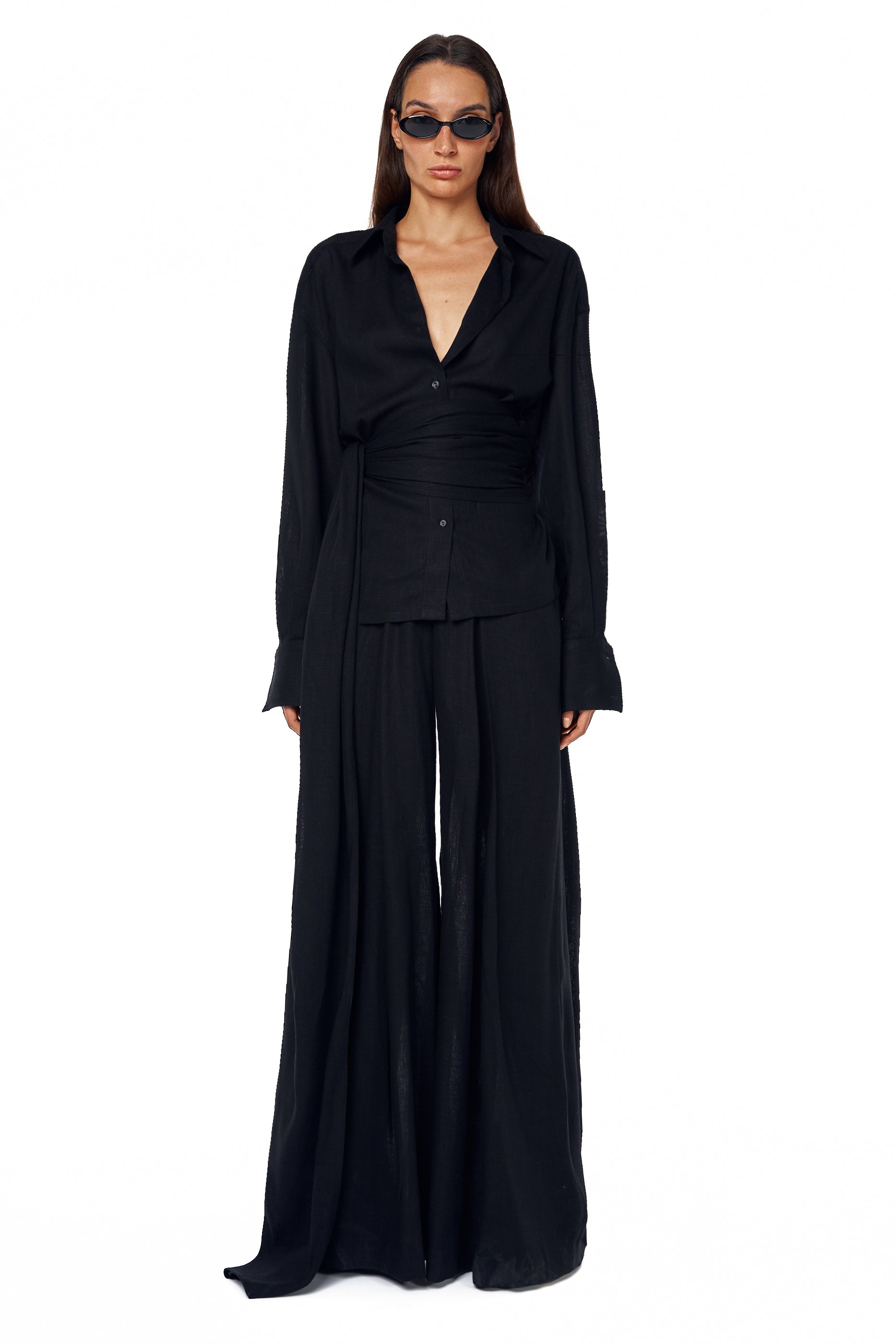 Black trousers with pleated wide-leg design — Lama Jouni