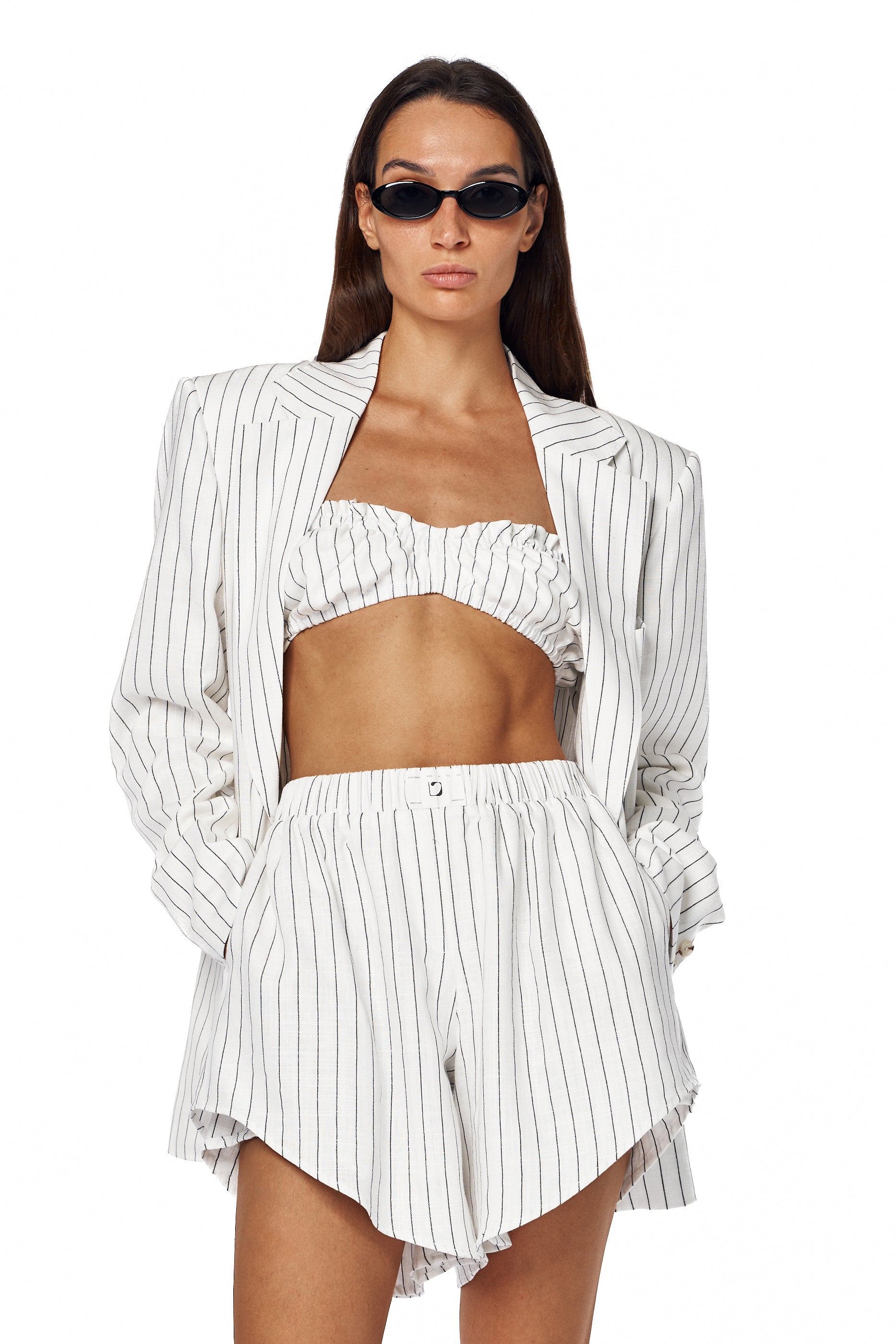 White linen blazer with clean lines — Lama Jouni
